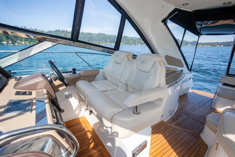  Yacht Photos Pics Luxurious interior of 2018 Cobalt 46 Yacht with plush seating and scenic water view.