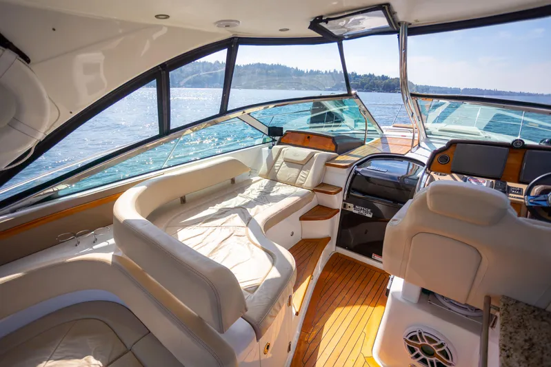  Yacht Photos Pics Luxurious interior of 2018 Cobalt 46 Yacht with plush seating and scenic water view.