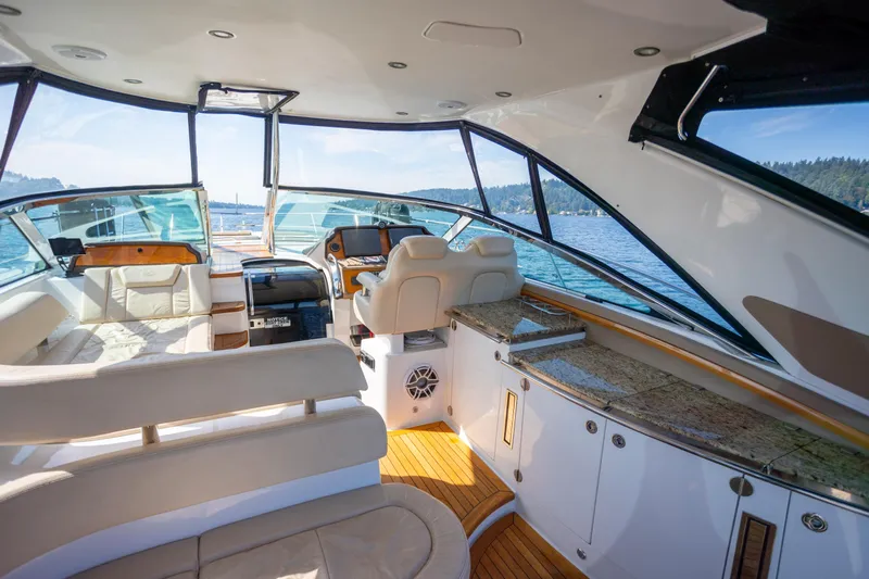  Yacht Photos Pics Luxurious interior of 2018 Cobalt 46 Yacht with elegant seating and scenic water view.