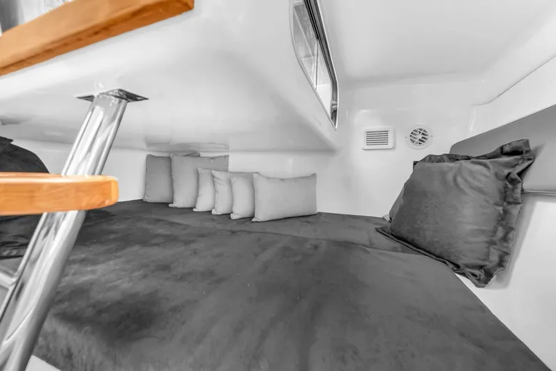  Yacht Photos Pics 2024 Hanover 305 interior cabin with cushions and sleek design.