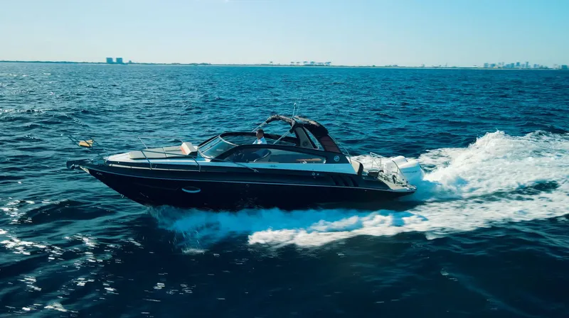  Yacht Photos Pics 2024 Hanover 305 boat cruising on open ocean waters.