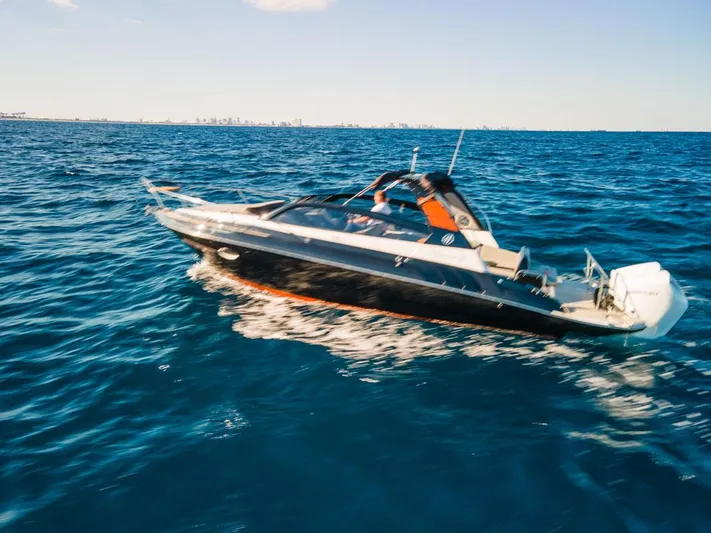  Yacht Photos Pics 2024 Hanover 305 boat cruising on open blue water under clear sky.