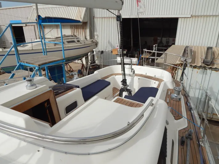  Yacht Photos Pics 1999 Oyster 42 Aft Cockpit Deck Saloon yacht in a boatyard setting.