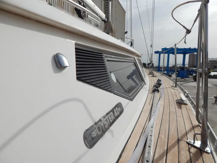  Yacht Photos Pics Oyster 42 Aft Cockpit Deck Saloon yacht, 1999 model, docked with visible deck and cabin details.