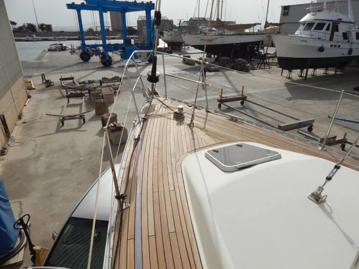 Yacht Photos Pics Oyster 42 Aft Cockpit Deck Saloon yacht on dry dock, showcasing teak deck, 1999 model.