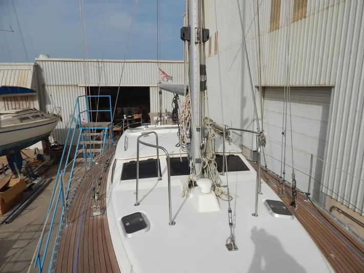  Yacht Photos Pics Oyster 42 Aft Cockpit Deck Saloon yacht, 1999, docked in a shipyard.