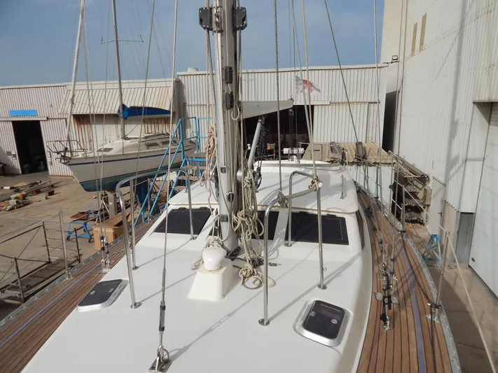  Yacht Photos Pics Oyster 42 Aft Cockpit Deck Saloon yacht, 1999 model, docked in a marina.