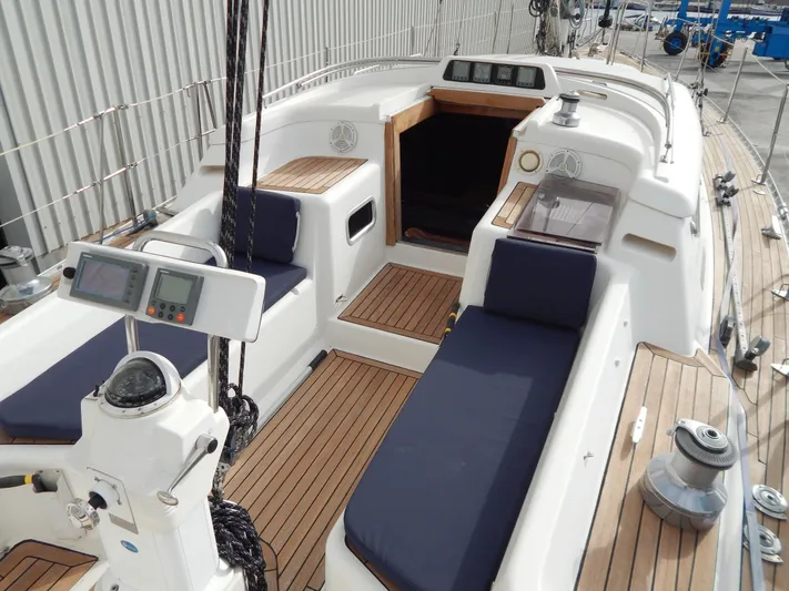  Yacht Photos Pics 1999 Oyster 42 Aft Cockpit Deck Saloon with teak deck and navigation instruments.
