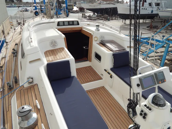  Yacht Photos Pics 1999 Oyster 42 Aft Cockpit Deck Saloon yacht with teak deck and navigation equipment.