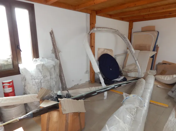  Yacht Photos Pics Storage room with wrapped parts for a 1999 Oyster 42 Aft Cockpit Deck Saloon yacht.