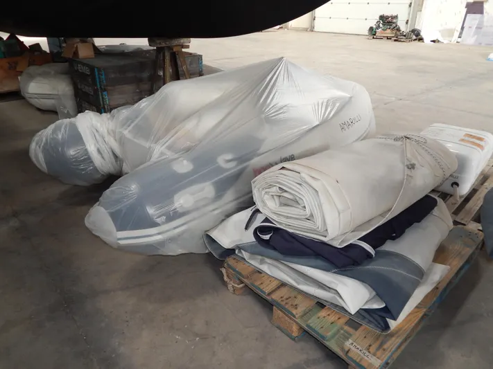  Yacht Photos Pics Wrapped boat equipment and sails on a pallet, Oyster 42 Aft Cockpit Deck Saloon, 1999.