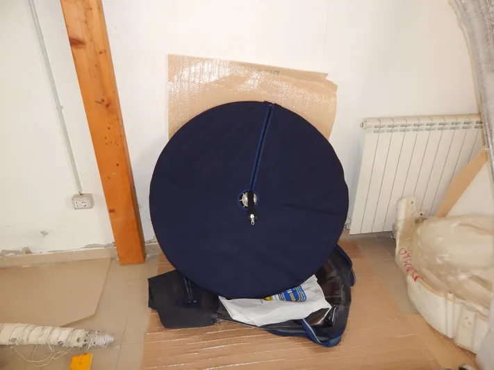  Yacht Photos Pics Circular blue cover in a room, possibly for Oyster 42 Aft Cockpit Deck Saloon, 1999.