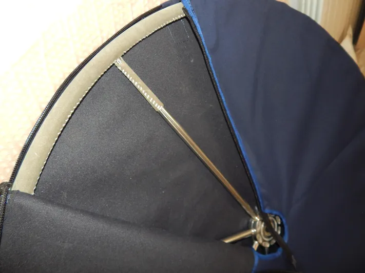  Yacht Photos Pics Close-up of a blue and black umbrella with metal ribs, Oyster 42 Aft Cockpit Deck Saloon, 1999.