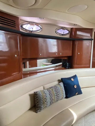 Viva La Vida Yacht Photos Pics Luxurious interior of 2006 Sea Ray 340 Sundancer with plush seating and elegant wood cabinetry.