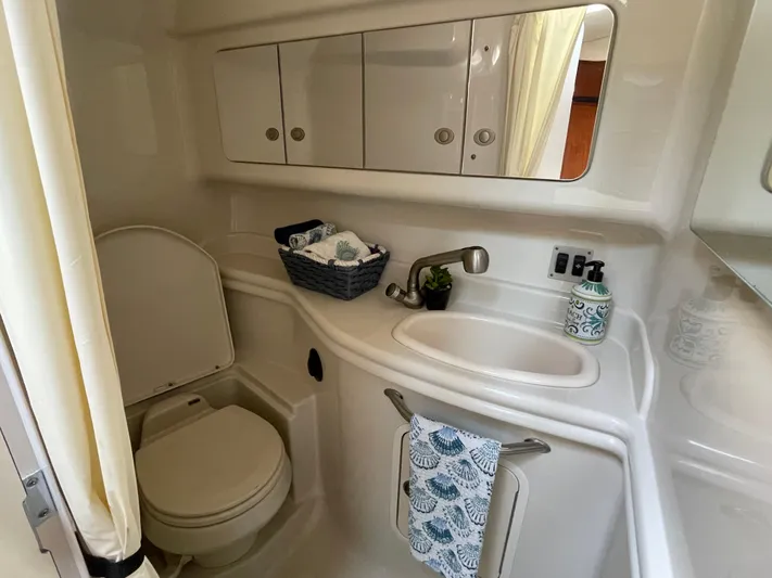 Viva La Vida Yacht Photos Pics Bathroom interior of 2006 Sea Ray 340 Sundancer yacht, featuring sink and toilet.