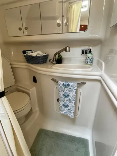 Viva La Vida Yacht Photos Pics Bathroom interior of 2006 Sea Ray 340 Sundancer yacht, featuring sink and storage.