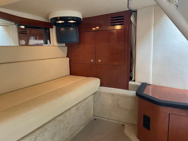 Viva La Vida Yacht Photos Pics Interior of 2006 Sea Ray 340 Sundancer, featuring beige seating and wooden cabinetry.
