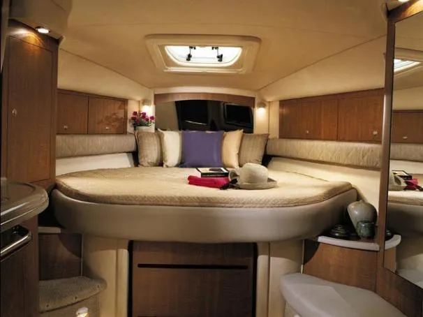 Viva La Vida Yacht Photos Pics Luxurious interior of 2006 Sea Ray 340 Sundancer yacht with cozy bed and elegant decor.