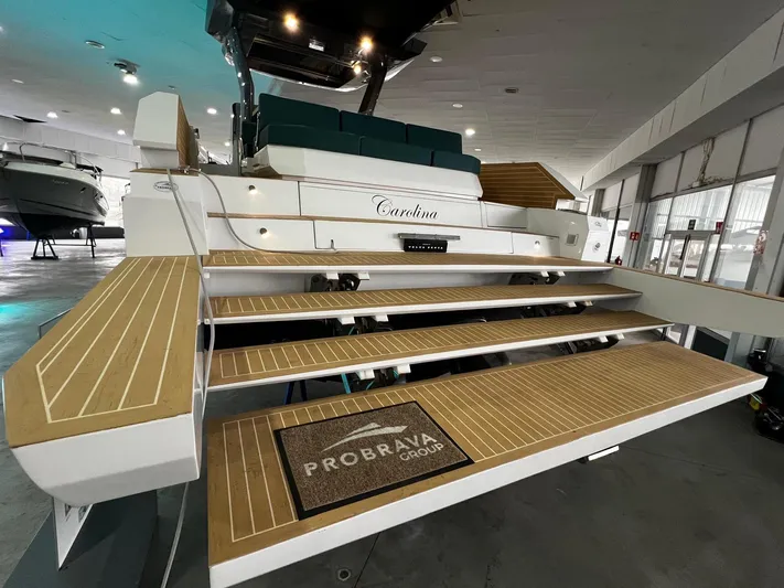 Fiart 39 Sw Yacht Photos Pics 2024 Fiart 39 Seawalker yacht with elegant wooden steps in a showroom.