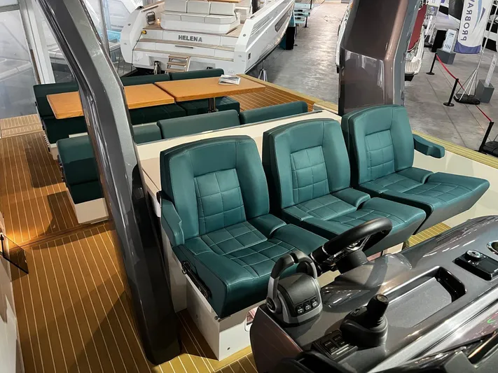Fiart 39 Sw Yacht Photos Pics 2024 Fiart 39 Seawalker interior with green seating and modern helm controls.