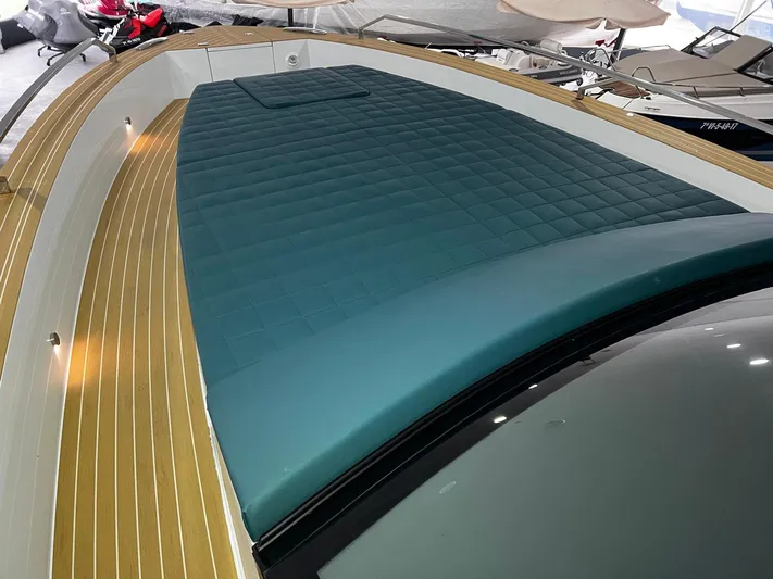 Fiart 39 Sw Yacht Photos Pics 2024 Fiart 39 Seawalker yacht with teal cushioned deck and wooden flooring.