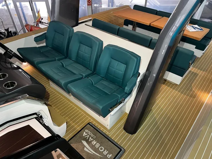 Fiart 39 Sw Yacht Photos Pics 2024 Fiart 39 Seawalker interior with teal seating and wooden flooring.