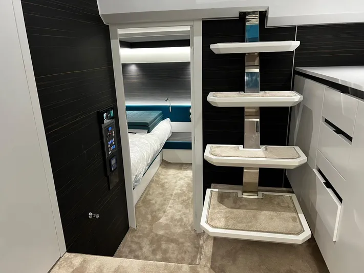 Fiart 39 Sw Yacht Photos Pics 2024 Fiart 39 Seawalker interior with modern design, featuring sleek shelving and a cozy bedroom.