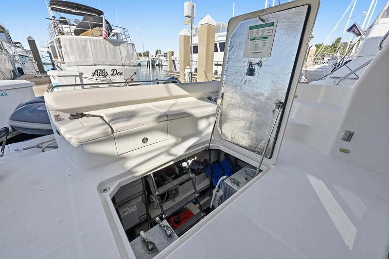 Endymion Yacht Photos Pics Open hatch on 2006 Carver 56 Voyager yacht, revealing storage and equipment.