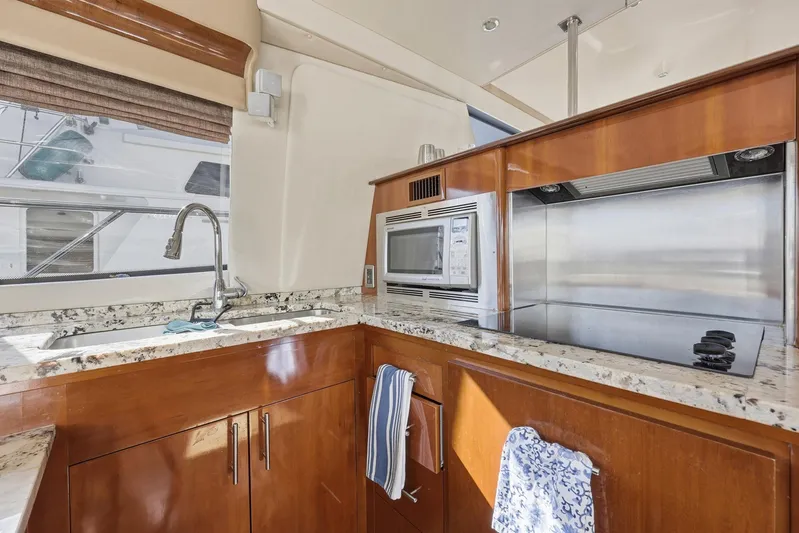 Endymion Yacht Photos Pics Luxurious kitchen in a 2006 Carver 56 Voyager yacht with modern appliances.