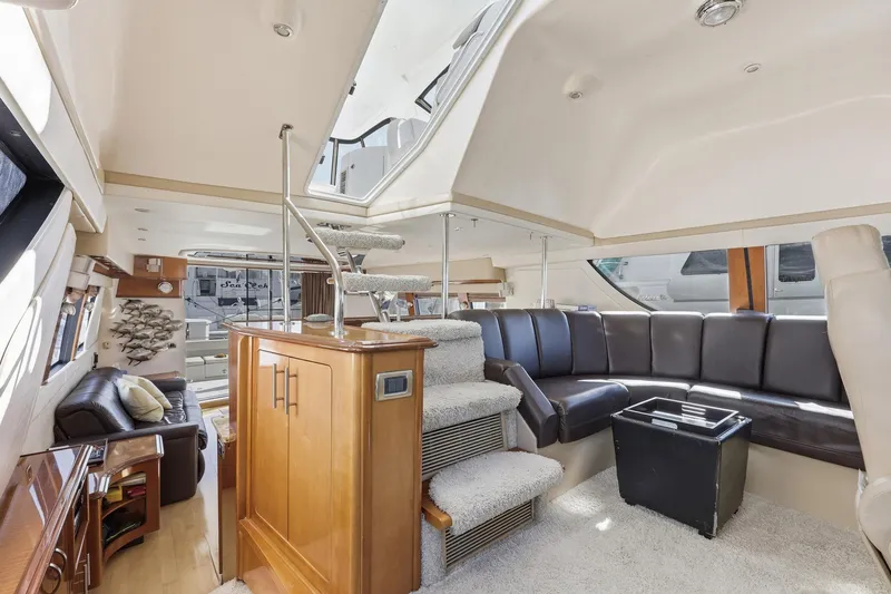 Endymion Yacht Photos Pics Luxurious interior of a 2006 Carver 56 Voyager yacht with plush seating and elegant design.