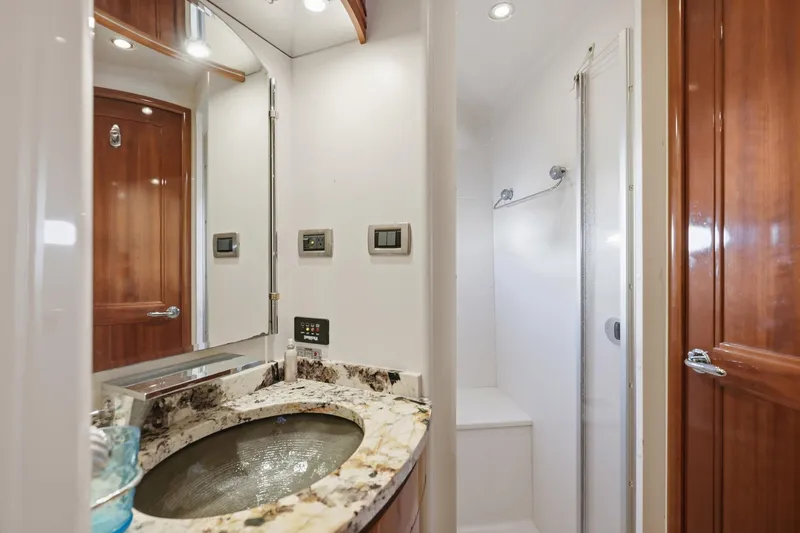 Endymion Yacht Photos Pics Luxurious bathroom in 2006 Carver 56 Voyager yacht with marble sink and shower.