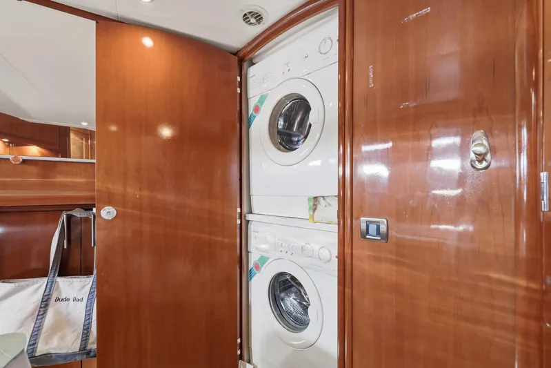 Endymion Yacht Photos Pics Laundry area inside 2006 Carver 56 Voyager yacht with stacked washer and dryer.
