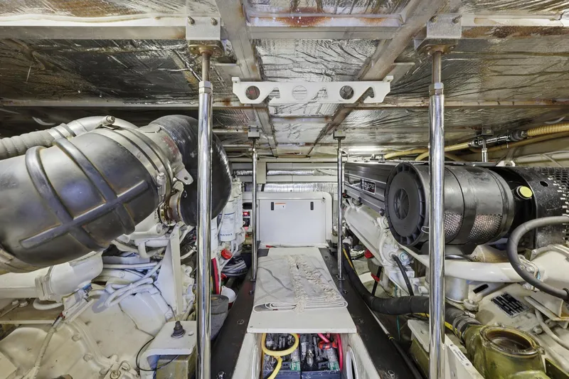 Endymion Yacht Photos Pics Engine room of 2006 Carver 56 Voyager yacht, showcasing mechanical components and equipment.