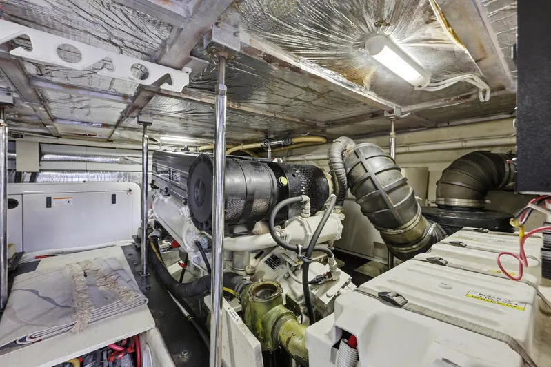 Endymion Yacht Photos Pics Engine room of 2006 Carver 56 Voyager yacht, showcasing mechanical components and systems.