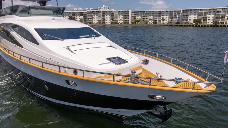 Sea Metri V Yacht Photos Pics Luxurious 2017 Amer 94 yacht cruising on water near modern waterfront buildings.