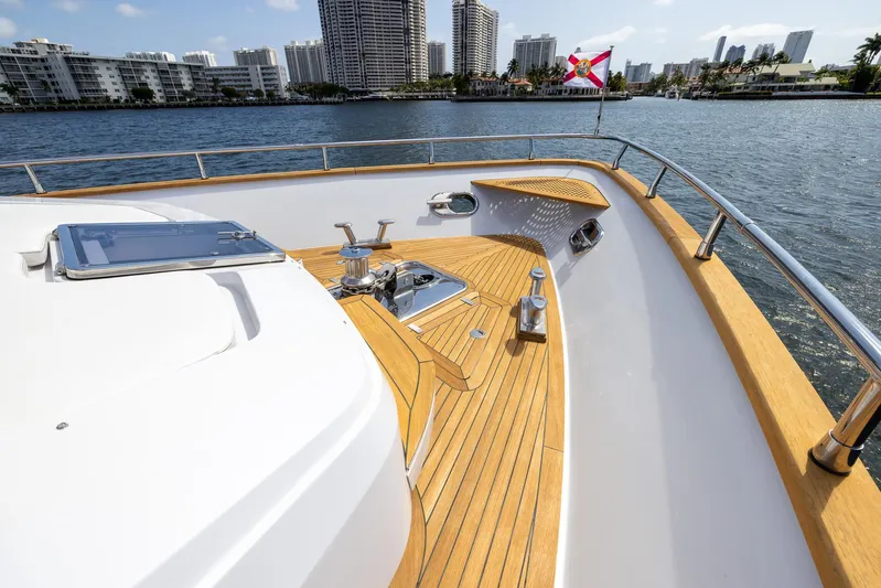 Sea Metri V Yacht Photos Pics Luxury yacht deck with wooden finish, Amer 94 model, 2017, city skyline in background.