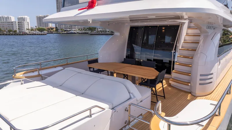 Sea Metri V Yacht Photos Pics Luxurious 2017 Amer 94 yacht deck with seating, table, and scenic waterfront view.