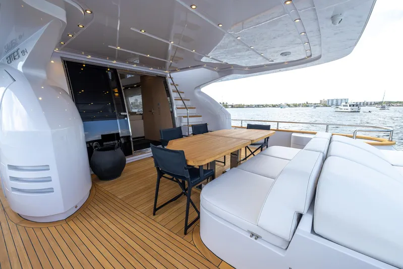 Sea Metri V Yacht Photos Pics Luxurious 2017 Amer 94 yacht deck with seating and dining area, overlooking serene waters.