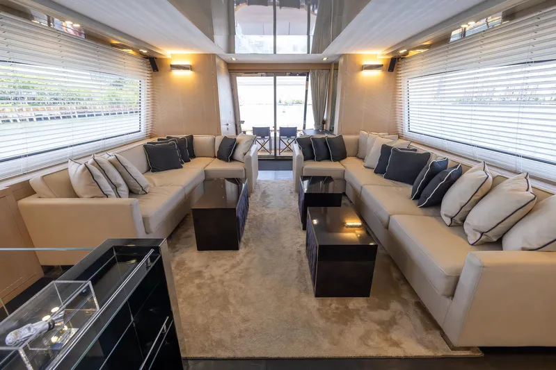 Sea Metri V Yacht Photos Pics Luxurious yacht interior with beige sofas, black cushions, and modern decor, Amer 94 model, 2017.