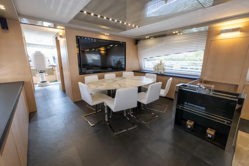 Sea Metri V Yacht Photos Pics Luxurious yacht interior with modern dining area, large TV, and sleek design, Amer 94, 2017 model.
