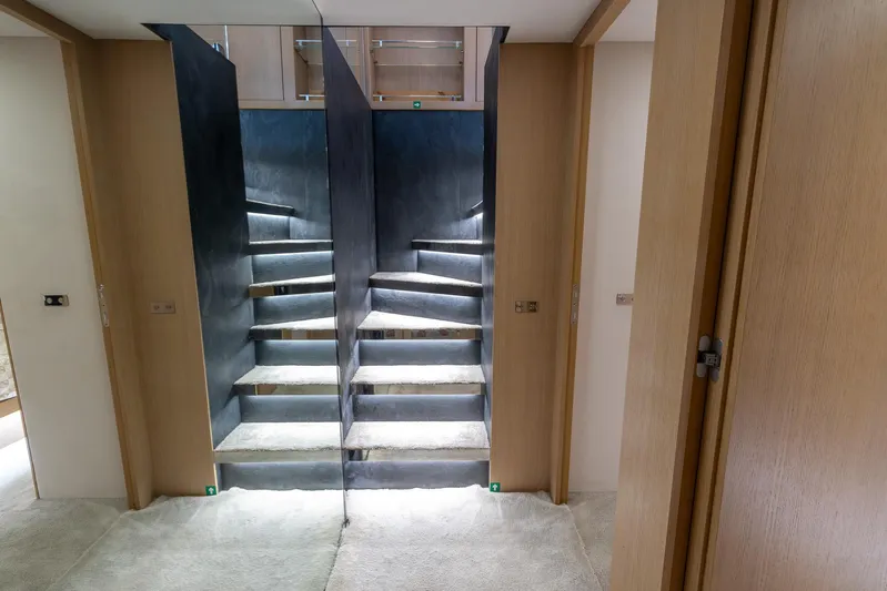 Sea Metri V Yacht Photos Pics Staircase with mirrored walls in a modern Amer 94 yacht, 2017 model.