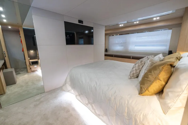 Sea Metri V Yacht Photos Pics Luxurious bedroom interior in 2017 Amer 94 yacht, featuring modern design and elegant bedding.