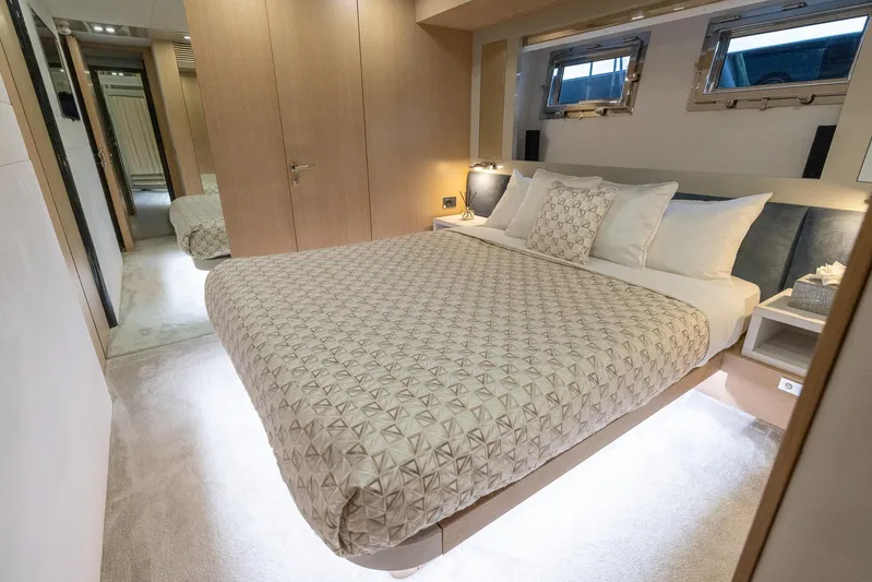 Sea Metri V Yacht Photos Pics Luxurious bedroom interior on a 2017 Amer 94 yacht, featuring a spacious bed and elegant decor.