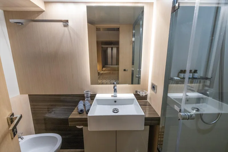 Sea Metri V Yacht Photos Pics Modern bathroom with sink, mirror, and glass shower in Amer 94 yacht, 2017 model.