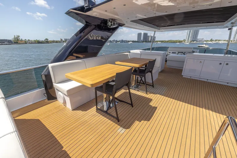 Sea Metri V Yacht Photos Pics Luxurious 2017 Amer 94 yacht deck with seating, tables, and scenic waterfront view.