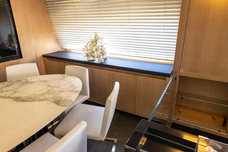Sea Metri V Yacht Photos Pics Luxurious yacht interior with marble table, white chairs, and elegant decor, Amer 94 model, 2017.