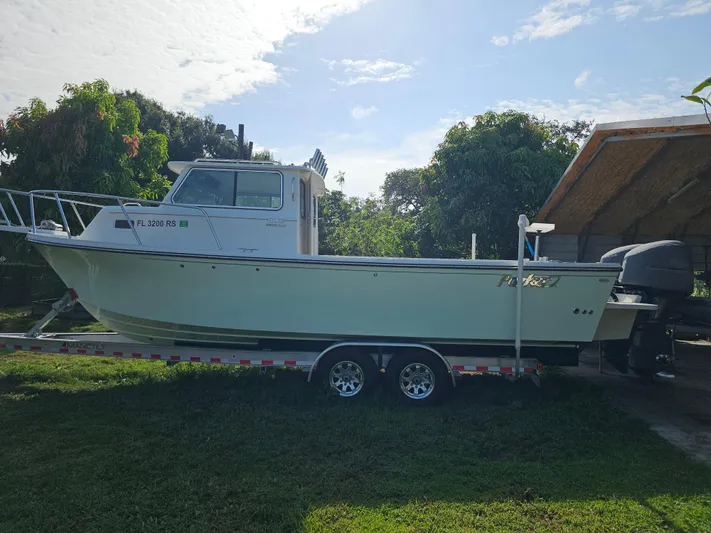  Yacht Photos Pics 2017 Parker 2820 XLD Sport Cabin boat on trailer, parked outdoors.