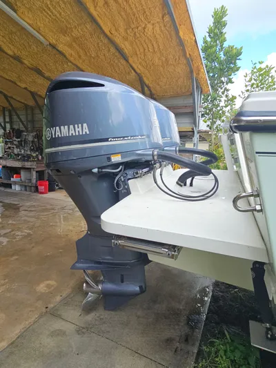  Yacht Photos Pics Yamaha outboard motor on 2017 Parker 2820 XLD Sport Cabin boat, parked under shelter.