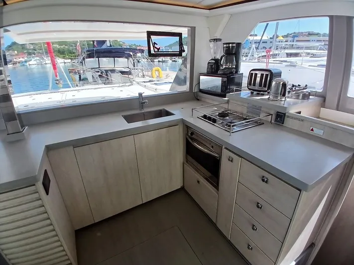 Sail La Vie Yacht Photos Pics Modern kitchen in 2019 Leopard 45 catamaran with appliances and marina view.
