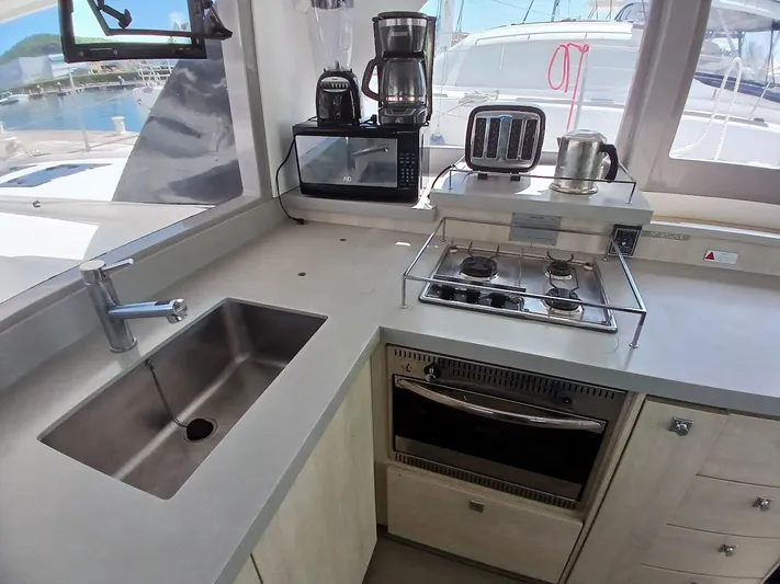 Sail La Vie Yacht Photos Pics Modern kitchen in 2019 Leopard 45 yacht with stove, sink, and appliances.